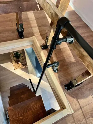 an overhead view of a wooden table with a black pole at The Cube in Samokov
