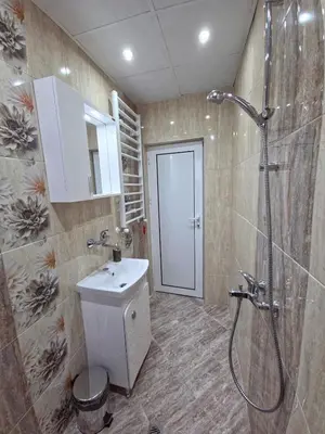 a bathroom with a shower and a toilet and a sink at Guest house Belitsa in Semkovo
