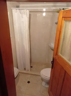 a bathroom with a toilet and a sink at Марковата Къща in Madzhare