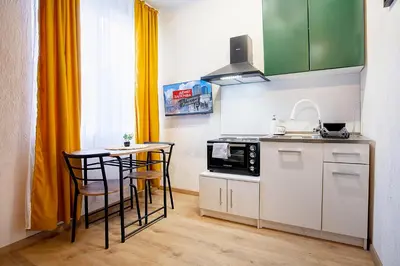 a small kitchen with a table and a microwave at Cozy Homes Slivnitsa Studios in Sofia