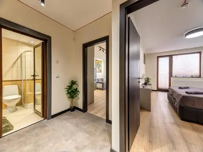 a bedroom with a bed and a bathroom at 1BD Mountain Getaway in Pamporovo with Parking By Flat Mаnager in Pamporovo