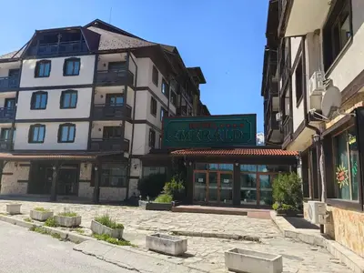 a building with a sign in front of it at Bansko Peak Apartments 116 in Bansko