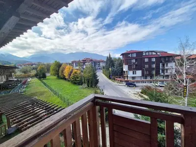 a balcony with a view of a street and buildings at 3 bedroom Penthouse only 700 meters from Ski Lift in Bansko