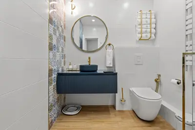 a bathroom with a sink and a toilet at Kapana - a 106m2 Flat right on the Pedestrian Street in Plovdiv