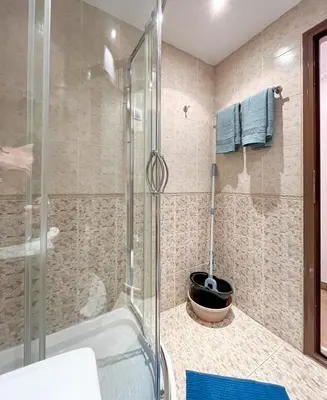 a bathroom with a shower and a bath tub at Bansko Peak Apartments 106 in Bansko