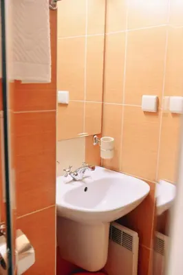 a bathroom with a white sink and a mirror at GOLF Queen MARIA Apartment Home2Host in Razlog