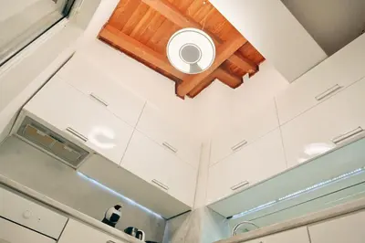 a coffered ceiling with a skylight in a kitchen at GOLF Queen MARIA Apartment Home2Host in Razlog