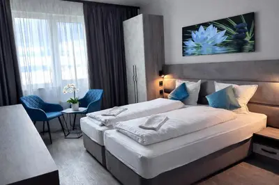 a bedroom with a large bed in a room at Vital Hotel in Sofia
