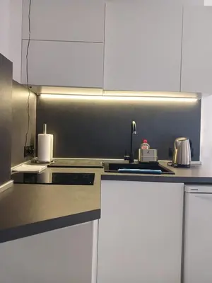 a kitchen with a sink and a counter top at Monfort Studio in Bansko