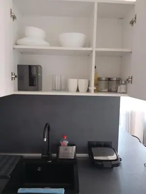 a kitchen with a sink and a counter top at Monfort Studio in Bansko