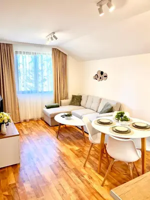 a living room with a couch and tables at Pamporovo Cozy Ski-Close Nest in Pamporovo