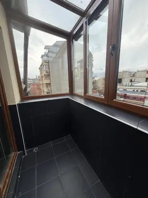 an empty room with windows and a tiled floor at New cozy apartment with undefloor heating 86m2 in Sofia