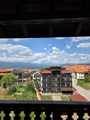 a view of a city from a balcony at Balcony and Mountain View 7 min Walk to Ski Gondola in Bansko