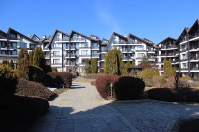 a large apartment building with a pathway in front of it at Comfort apartment in the house in Razlog