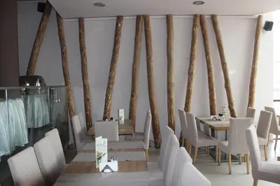 a dining room with a table and chairs at Comfort apartment in the house in Razlog