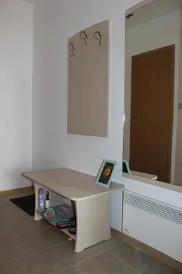 a desk in a room with a mirror at Comfort apartment in the house in Razlog