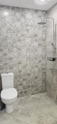 a bathroom with a toilet and a shower at By The Pool Apartments #8 in Velingrad