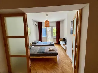 a bedroom with two beds in a room at Beautiful Bright and Spacious Central Apt in Sofia