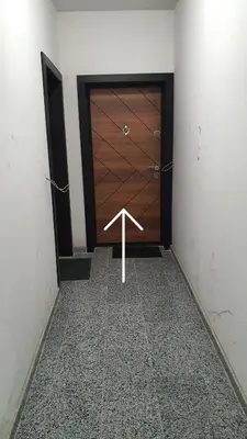 a room with a large wooden door in a room at Panorama city view 2 in Gotse Delchev
