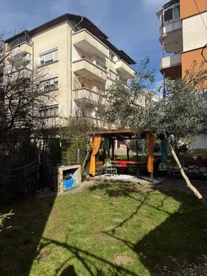 a yard in front of a large apartment building at Berta Gardens 2 in Sandanski