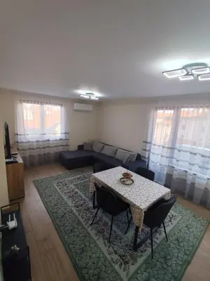 a living room with a table and a couch at Martin's Apartment in Bansko