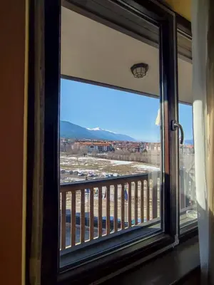 a window with a view of a city at Private Studio in Royal Park in Bansko