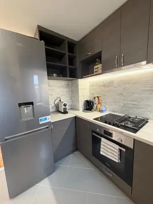 a kitchen with a stainless steel stove top oven at New cozy 3 bedroom apartment 90m2 in Sofia