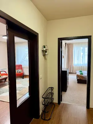 a room with a door open to a bedroom at Gino's place Home2Host in Bansko