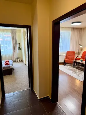 a room with a door open to a living room at Gino's place 2 Home2Host in Bansko