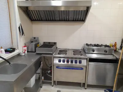 a kitchen with a stove and a sink at Daisy Forest in Borino