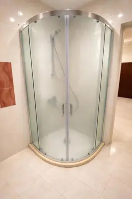 a shower with a glass enclosure in a bathroom at Old Town Prime Apartment & Parking in Plovdiv