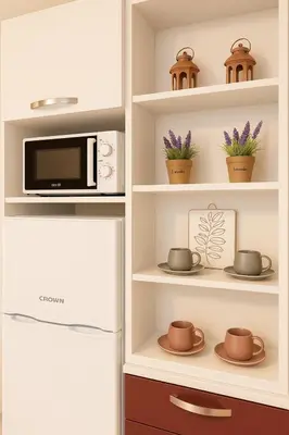 a kitchen with a refrigerator and a microwave at Old Town Prime Apartment & Parking in Plovdiv