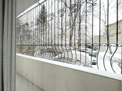 a balcony with a fence with a view of a street at 2BR Apt - Parking - Central - 1st floor - ACs in Sofia