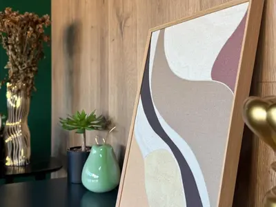 a picture frame sitting on a table next to a vase at Central 2BR with Designer Interior and Work Desk in Sofia