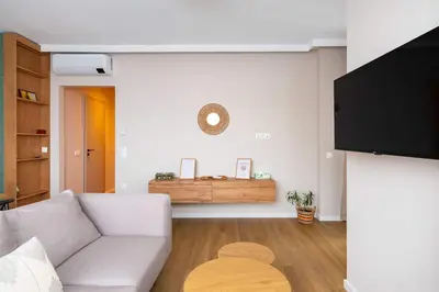 a living room with a couch and a table at Spacious 2BR Apartment - Modern Design in Sofia