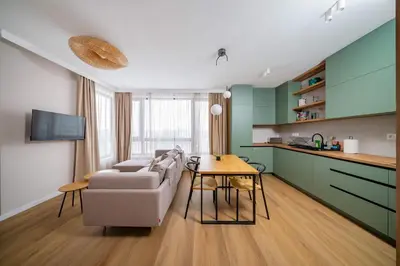 a living room with a couch and a table at Spacious 2BR Apartment - Modern Design in Sofia