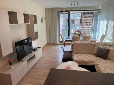 a living room with a couch and a television at 5 minutes sity center plus parking in Plovdiv