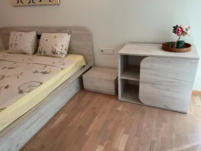 a small bedroom with a bed and a desk at 5 minutes sity center plus parking in Plovdiv