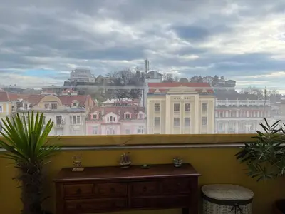 a window with a view of a city at Belview Apartment with Panoramic Old Town View in Plovdiv