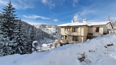 a house on top of a snow covered mountain at The House in Stoykite