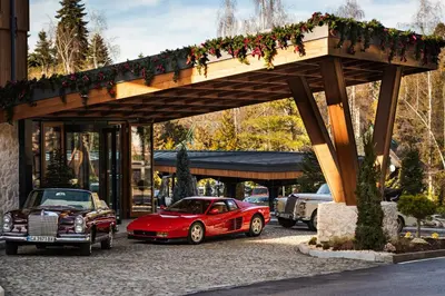 a red car parked in front of a building at Flora Boutique Hotel in Borovets