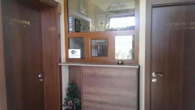a wooden door in a room with a window at Mini Complex Rilski Terasi in Sapareva Banya