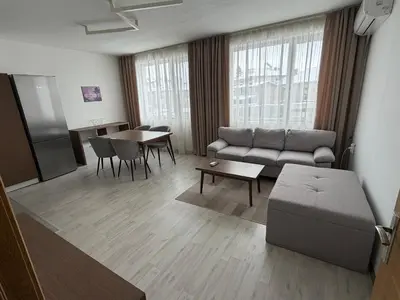 a living room with a couch and a table at Velingrad Prime 2-Bedroom Apartment in Velingrad