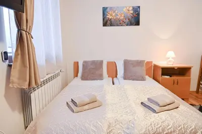 a bedroom with a bed with two towels on it at The Mountain Hug Studio 1 by SI Stay in Bansko