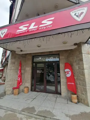 a store with red signs on the front of it at Iglika 2, A13 & A14 in Borovets