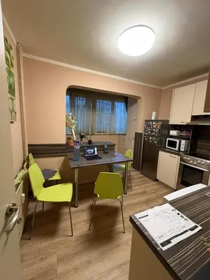 a kitchen with a table and chairs in a room at Abdovica House in Sofia
