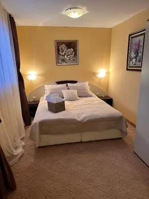 a bedroom with a large bed with a box on it at Пампорово Mountain Lodge апартамент 46 in Pamporovo
