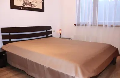 a bedroom with a large bed in a room at Rila Morning in Borovets