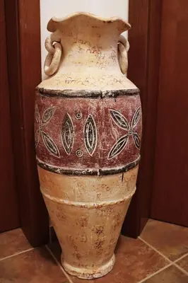 an old vase sitting on the floor in a room at Rila Morning in Borovets