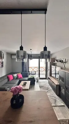 a living room with a couch and a table at Апартамент за гости Noa Sift in Velingrad
